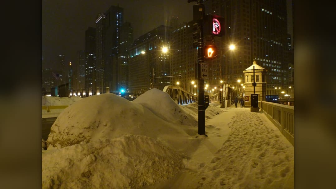 Deep snow piled along streets during winter in Chicago, Illinois
