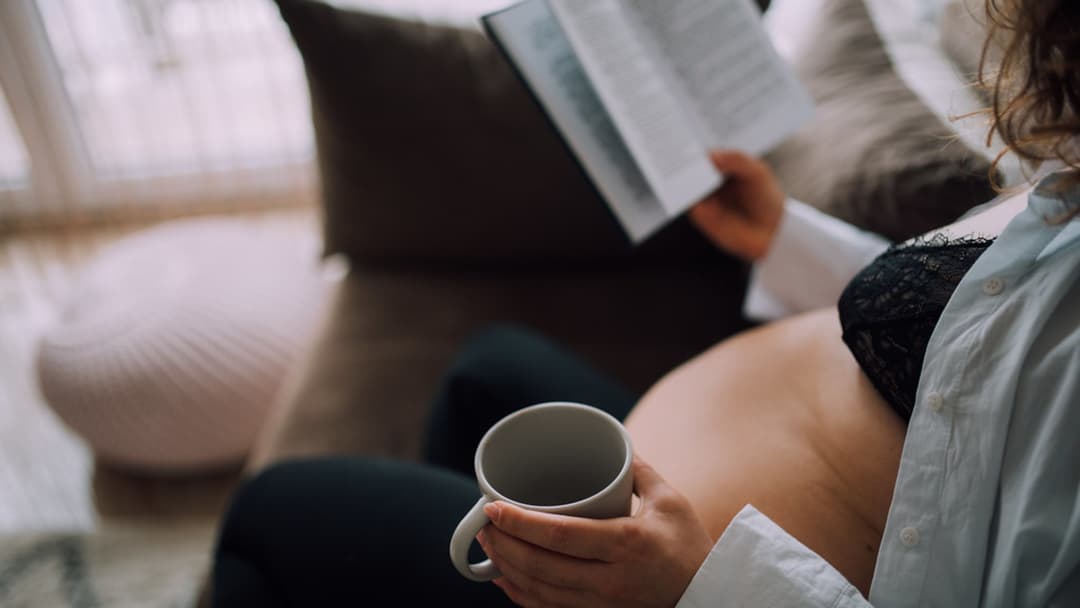 2. Reading A Paper Book Relaxed On The Sofa Before Bed