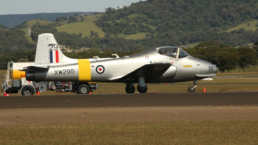 Camouflaged BAC Strikemaster light attack jet at Duxford airfield in England