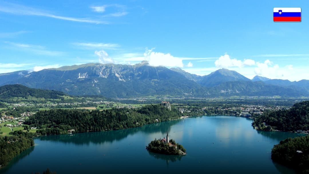 Lake Bled with its iconic church island surrounded by green alpine mountains in Slovenia.