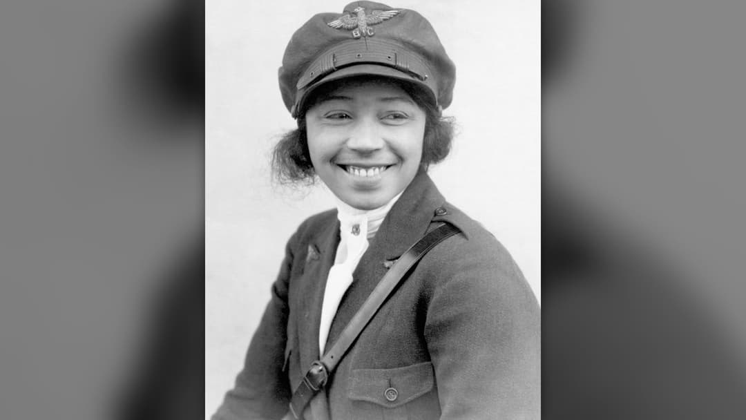 Pioneering aviator Bessie Coleman posing in her flight uniform
