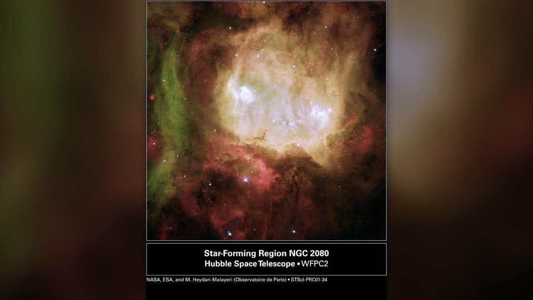 Hubble Space Telescope image of the Ghost Head Nebula NGC 2080 showing two bright white glowing eyes