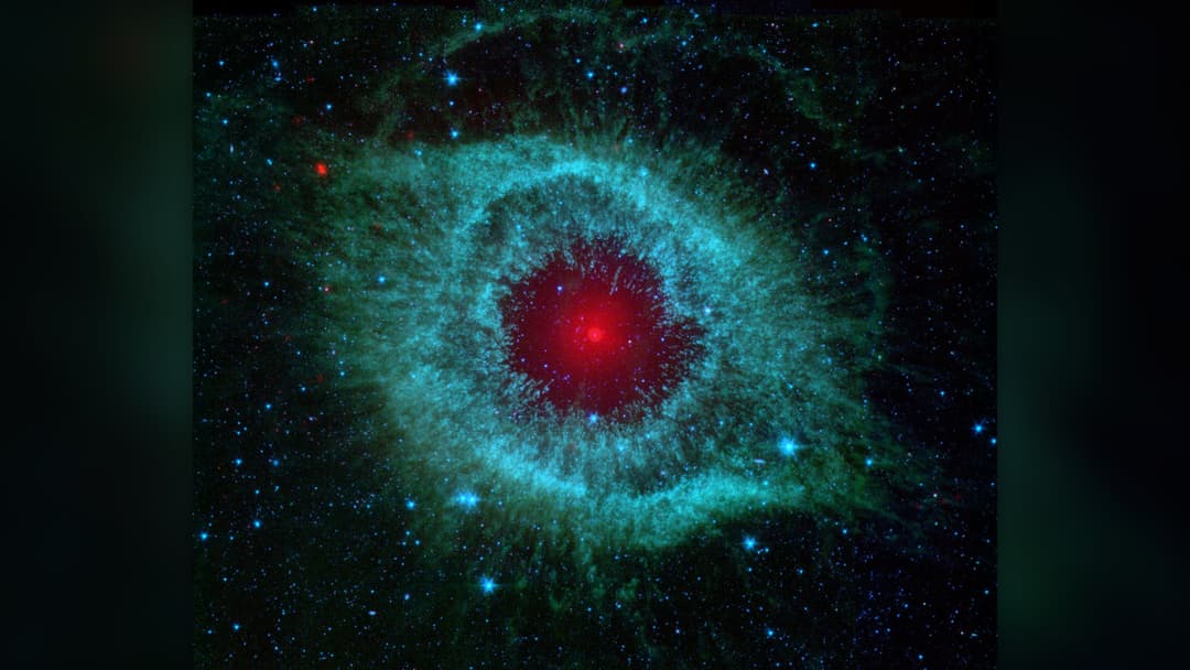 NASA Spitzer Space Telescope infrared photograph of the Helix Nebula NGC 7293 resembling the Eye of Sauron