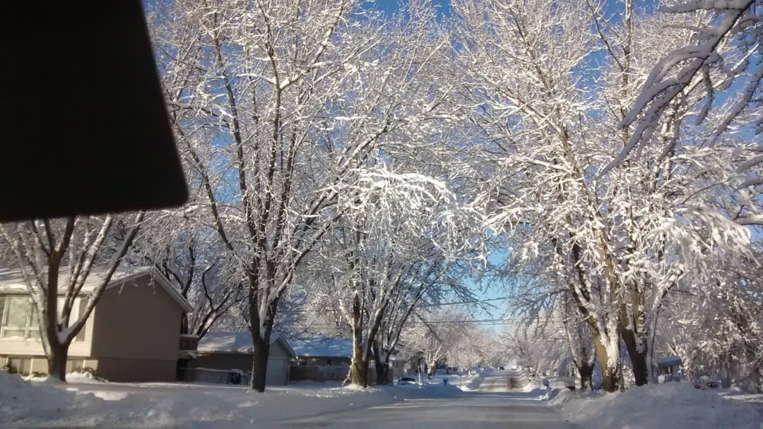 Deep winter snowscape across rural Iowa countryside