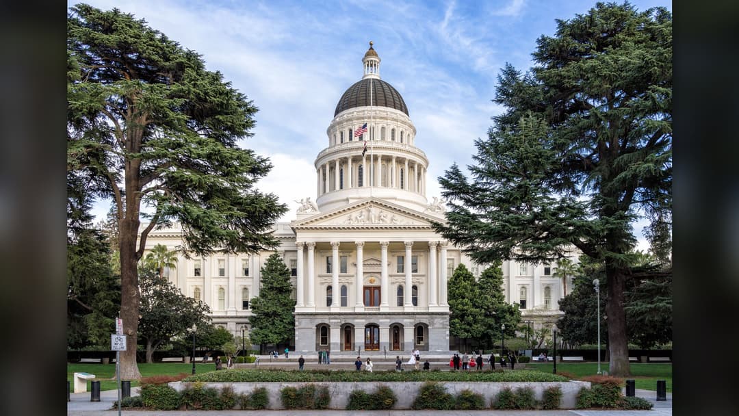 Exterior view of the white dome of the California State Capitol building in Sacramento