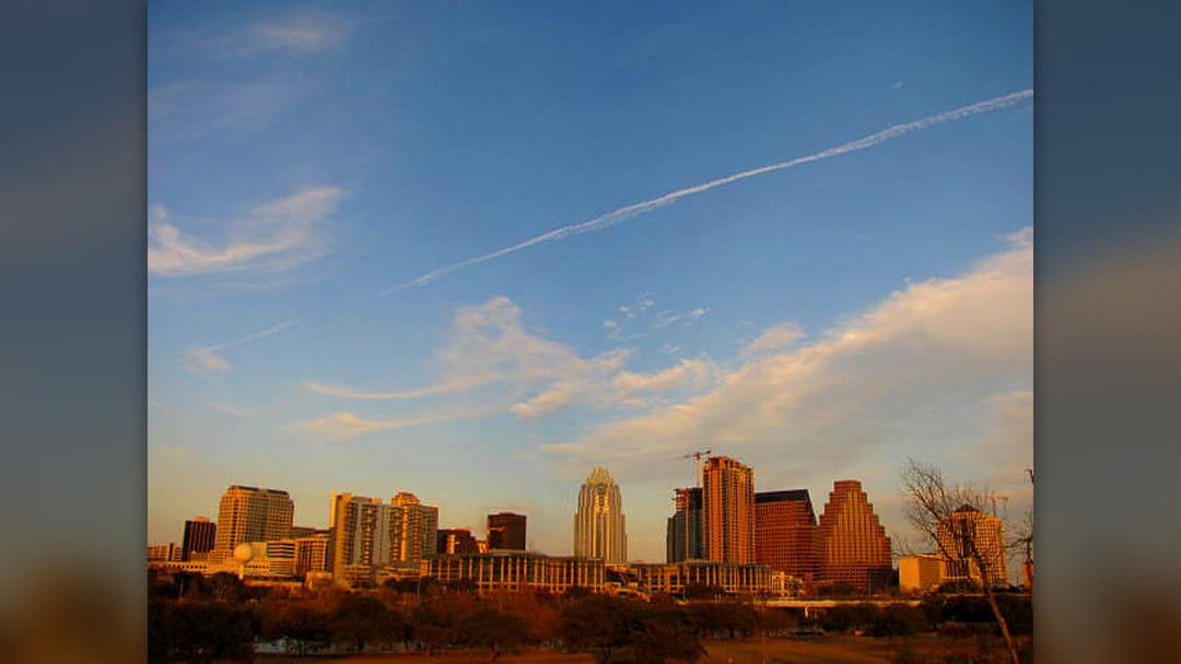 Downtown Austin Texas skyline reflected in Lady Bird Lake at sunset