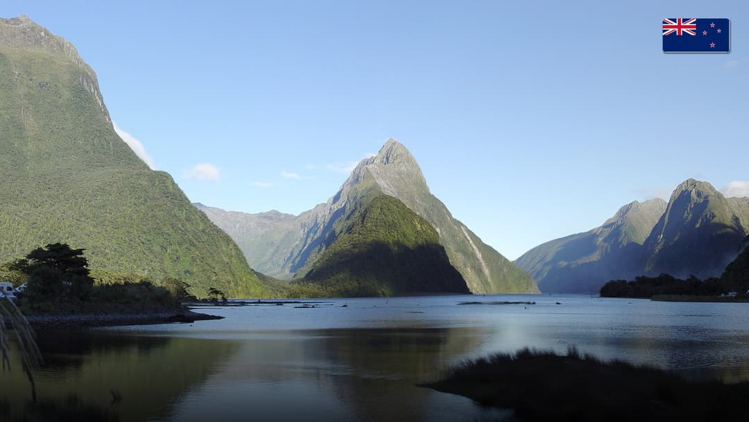 Lush rainforest fiords and soaring peaks of Milford Sound in New Zealand.