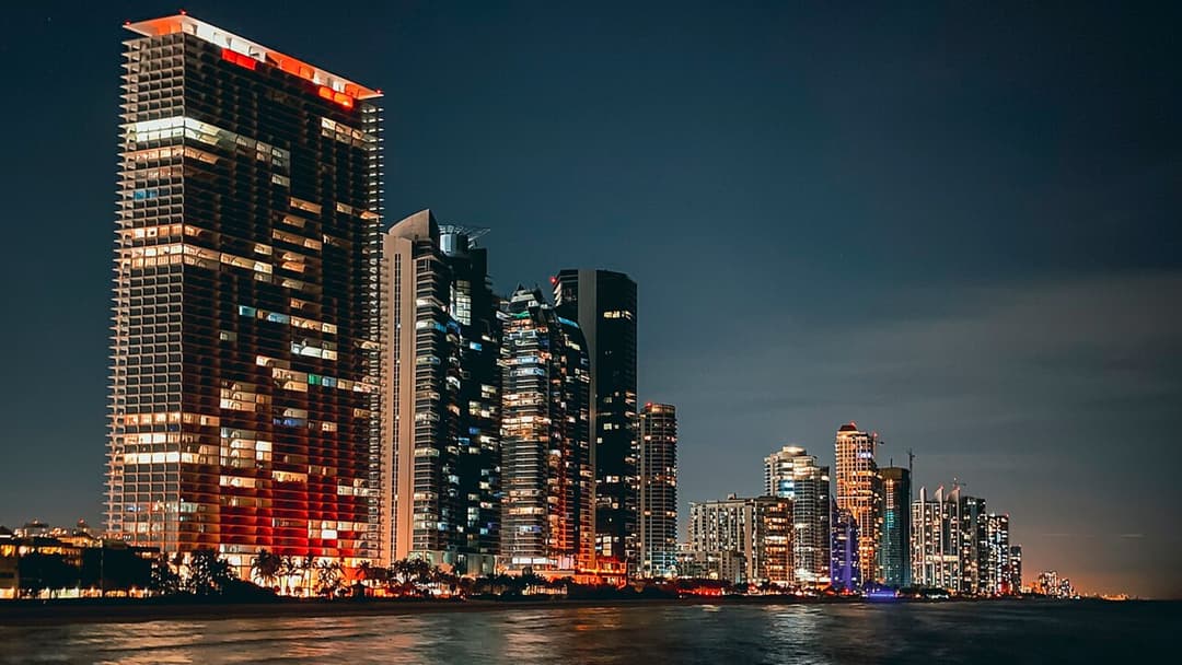 Downtown Miami skyline seen across the ocean water.