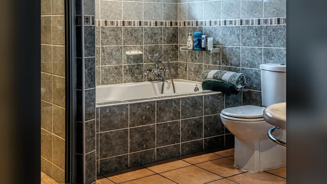 Tiled bathroom bathtub and shower enclosure