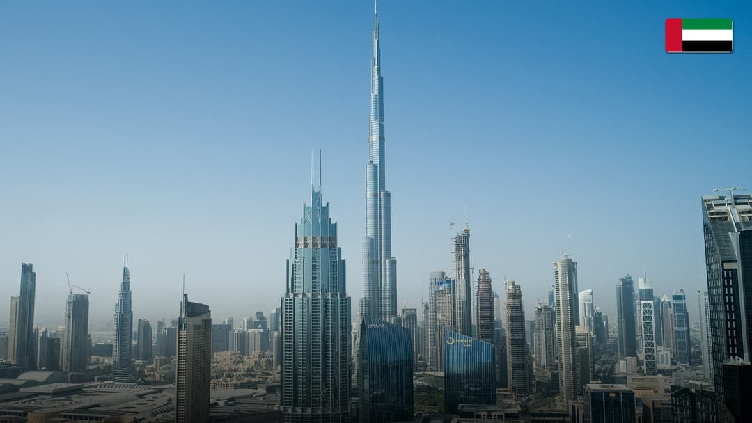 Illuminated skyscrapers and luxury yachts in Dubai Marina, United Arab Emirates.