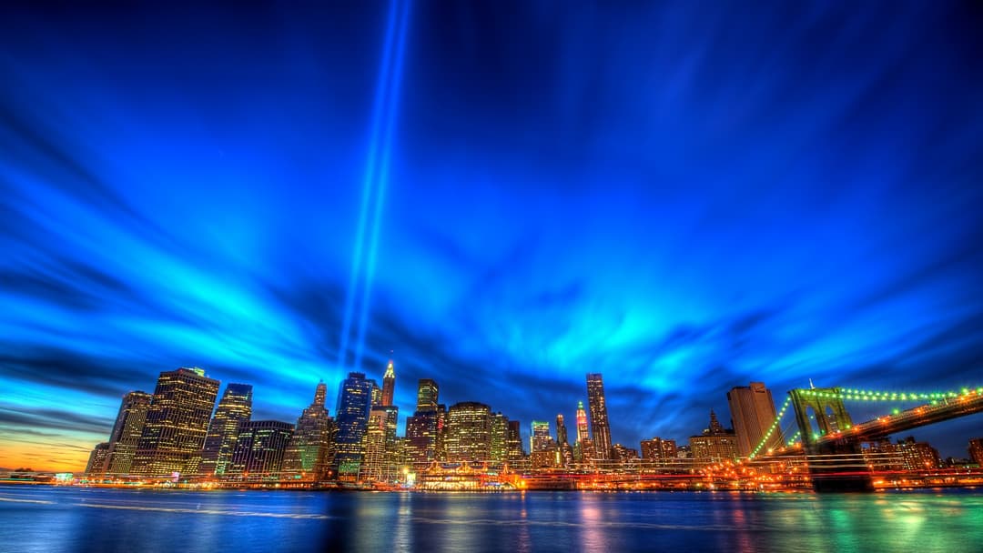 September 11 Tribute in Light rising over the Lower Manhattan skyline at dusk