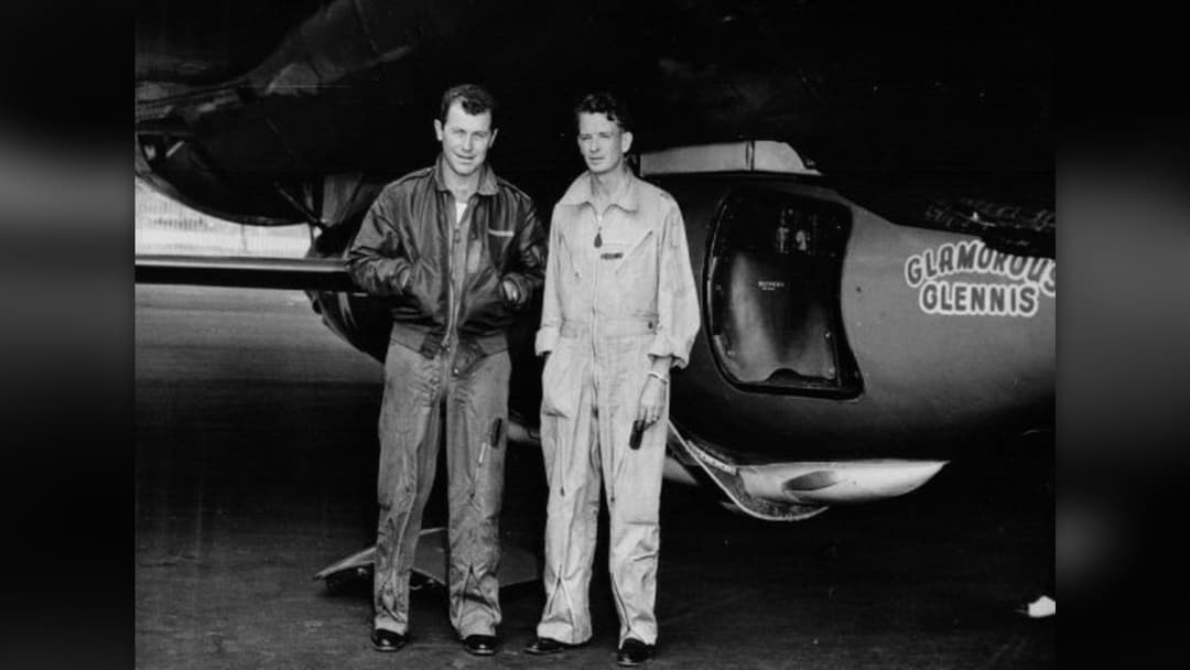 Test pilot Chuck Yeager and engineer Jack Ridley standing beside the Bell X-1 Glamorous Glennis rocket plane