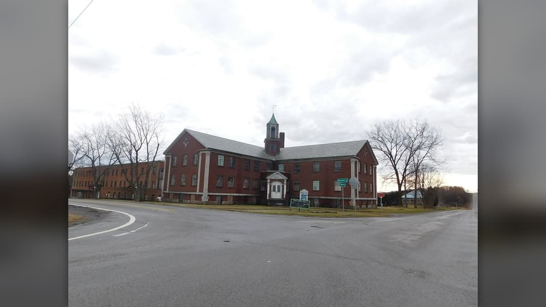 Brick facade of the former Genesee County Poorhouse now known as Rolling Hills Asylum in East Bethany, New York