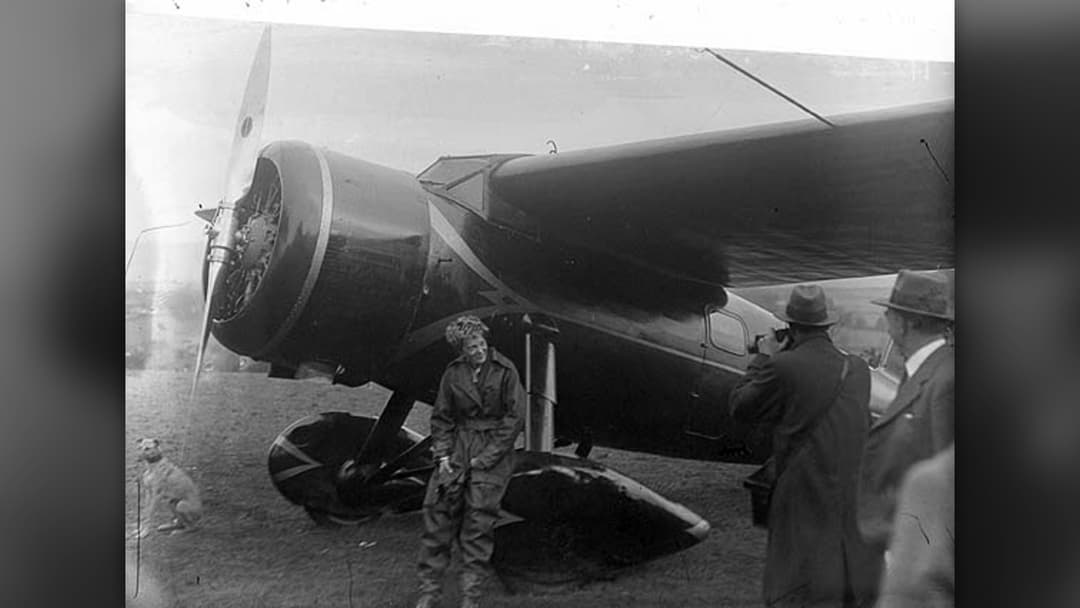 Amelia Earhart surrounded by well-wishers after landing her Lockheed Vega in Derry, Northern Ireland in May 1932