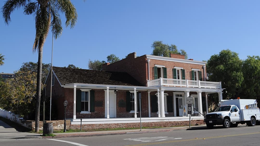 Two-story brick facade of the historic Whaley House in Old Town San Diego, California