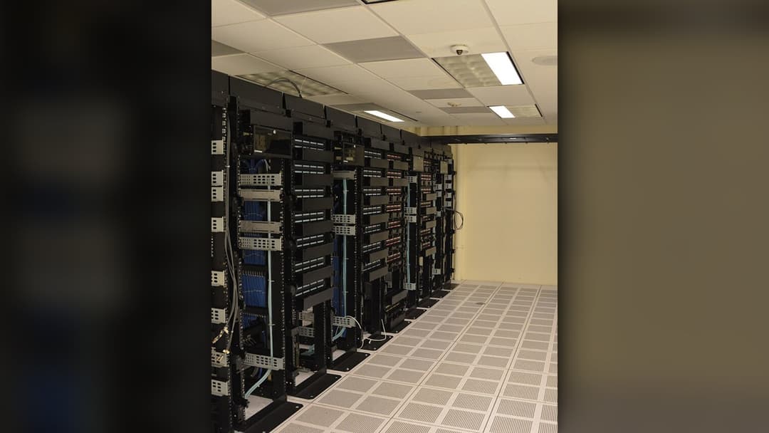 Data center server racks representing cloud infrastructure and remote game shutdowns.