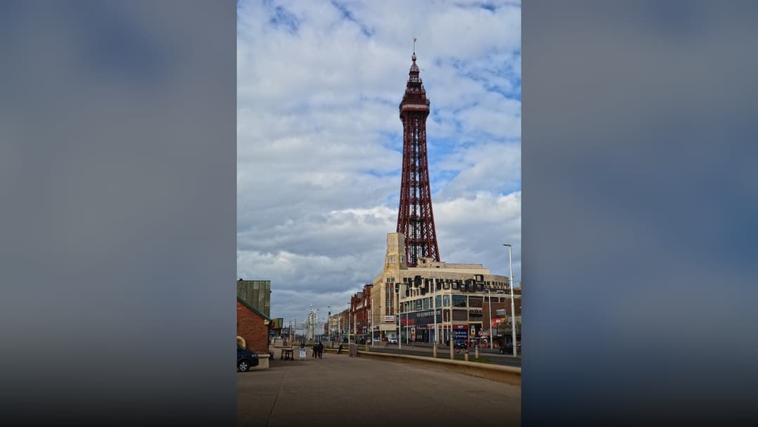 The famous Blackpool Tower rising above the seaside promenade in Blackpool, Lancashire.