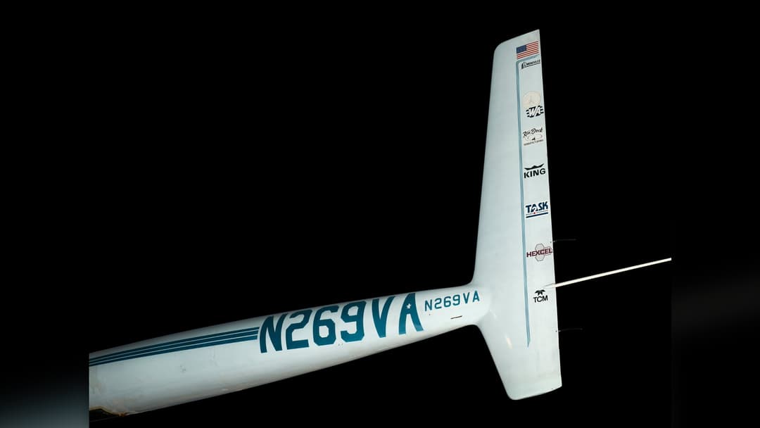 Rutan Voyager twin-boom composite aircraft flying during its 1986 unrefueled round-the-world mission