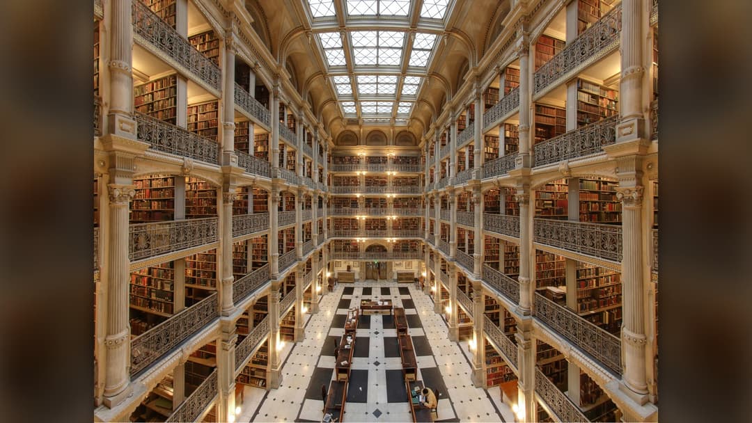 Six-story ornate cast-iron atrium of the George Peabody Library at the Peabody Institute in Baltimore