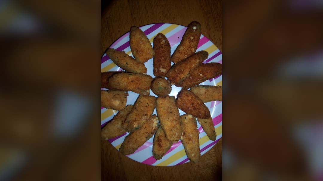 Crispy bacon wrapped jalapeno poppers stuffed with melted cheese