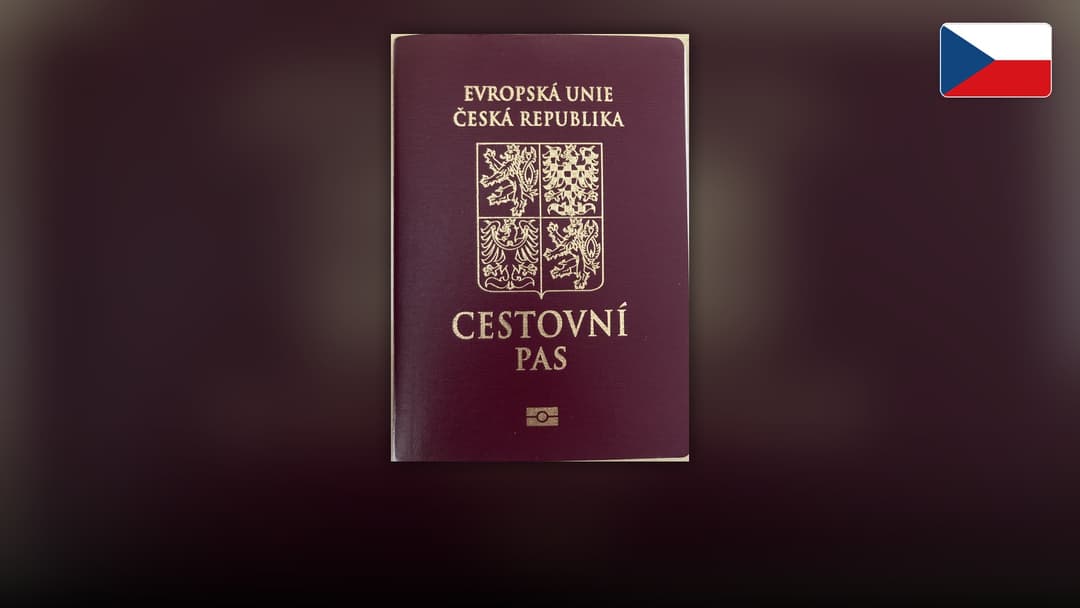 Burgundy Czech biometric passport cover with the Bohemian lion and Moravian eagle.
