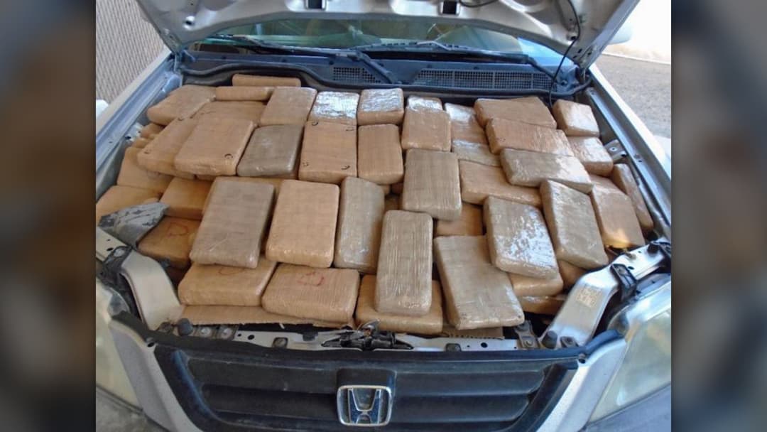 Tightly packed brown tape-wrapped bricks of marijuana seized by U.S. Customs and Border Protection officers