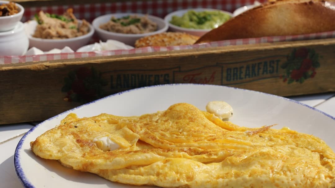 Folded egg omelet on a breakfast plate