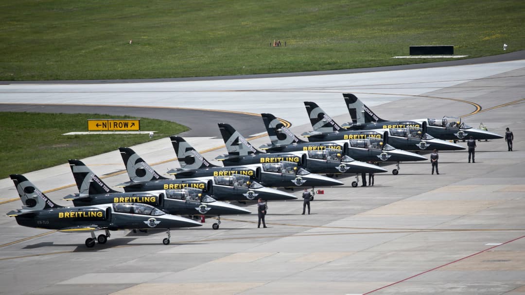 Aero L-39 Albatros Cold War jet trainers performing a tight formation pass at an airshow