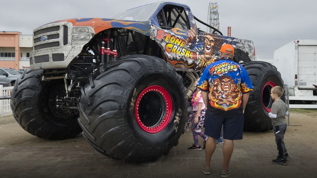 Massive Stone Crusher monster truck on display.