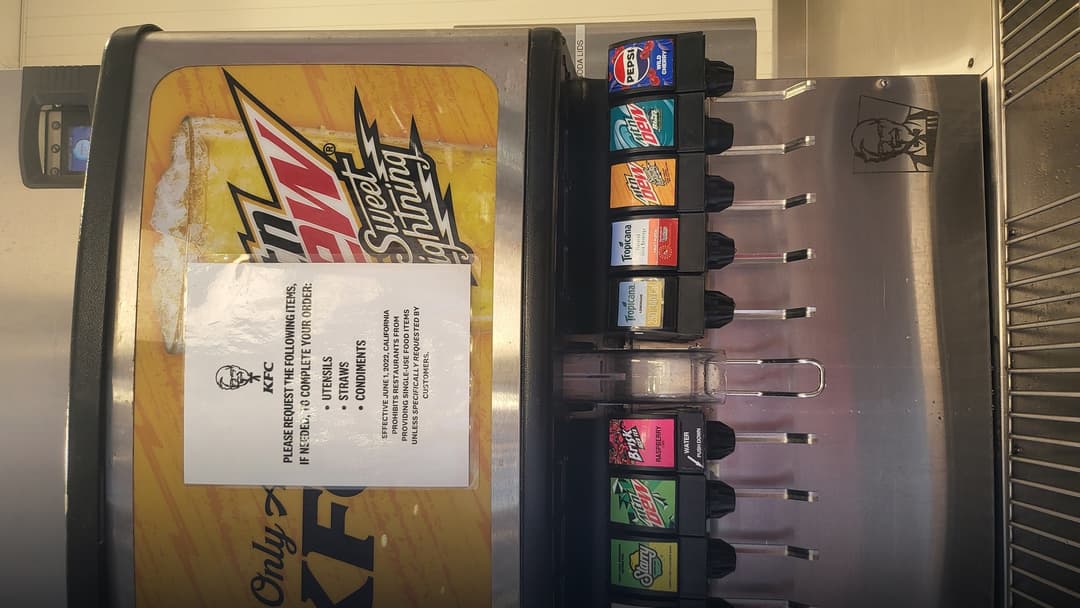 Commercial restaurant self-serve soda fountain drink refill dispenser.