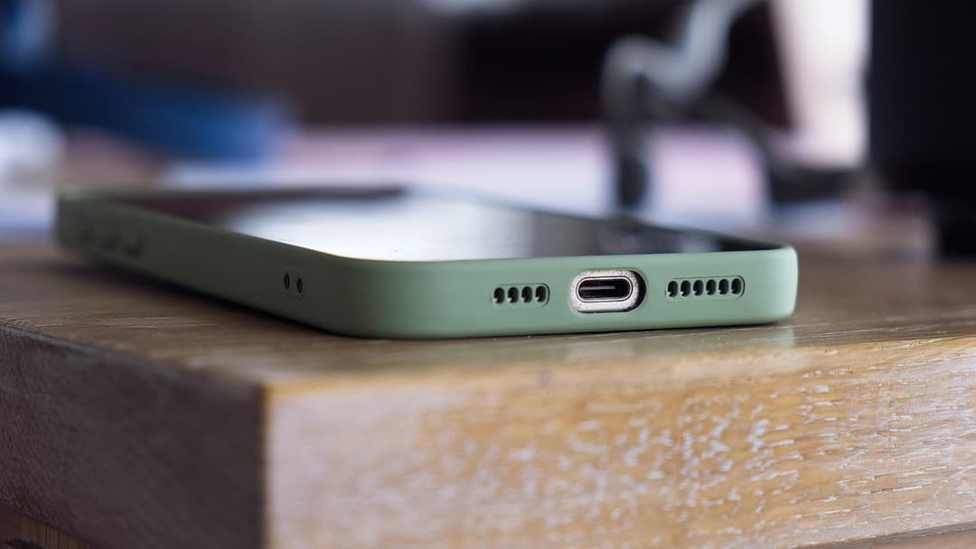 Close-up of a modern smartphone screen with a green indicator