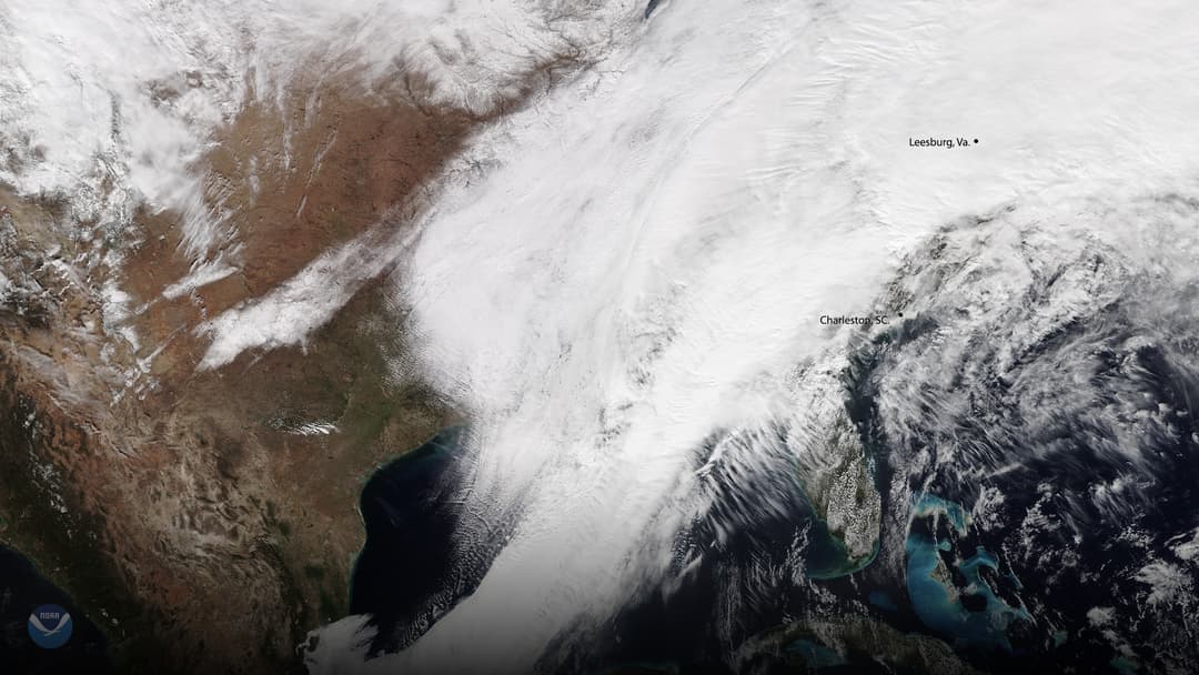 Heavy surf and churning waves slamming against a Gulf Coast shoreline.