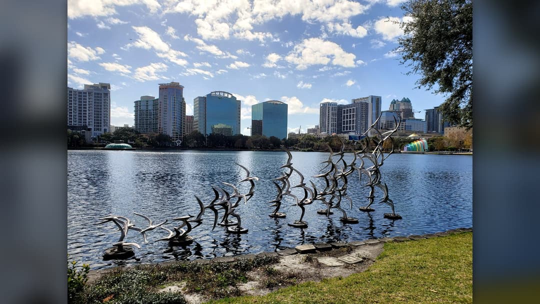 Sunny afternoon view of Lake Eola Park and the downtown Orlando Florida skyline