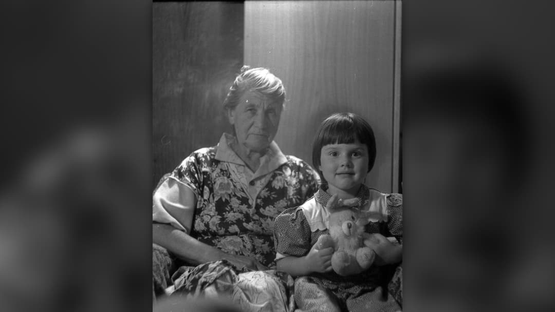 Russian grandmother sharing a warm moment with a younger family member