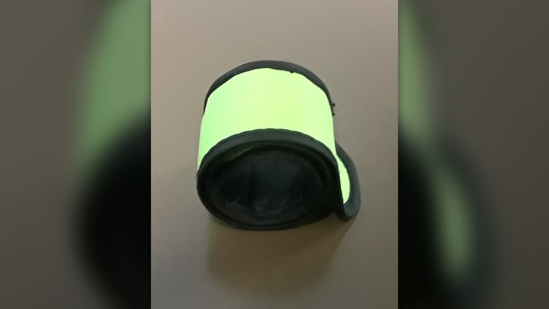 Neon green slap bracelet rolled up