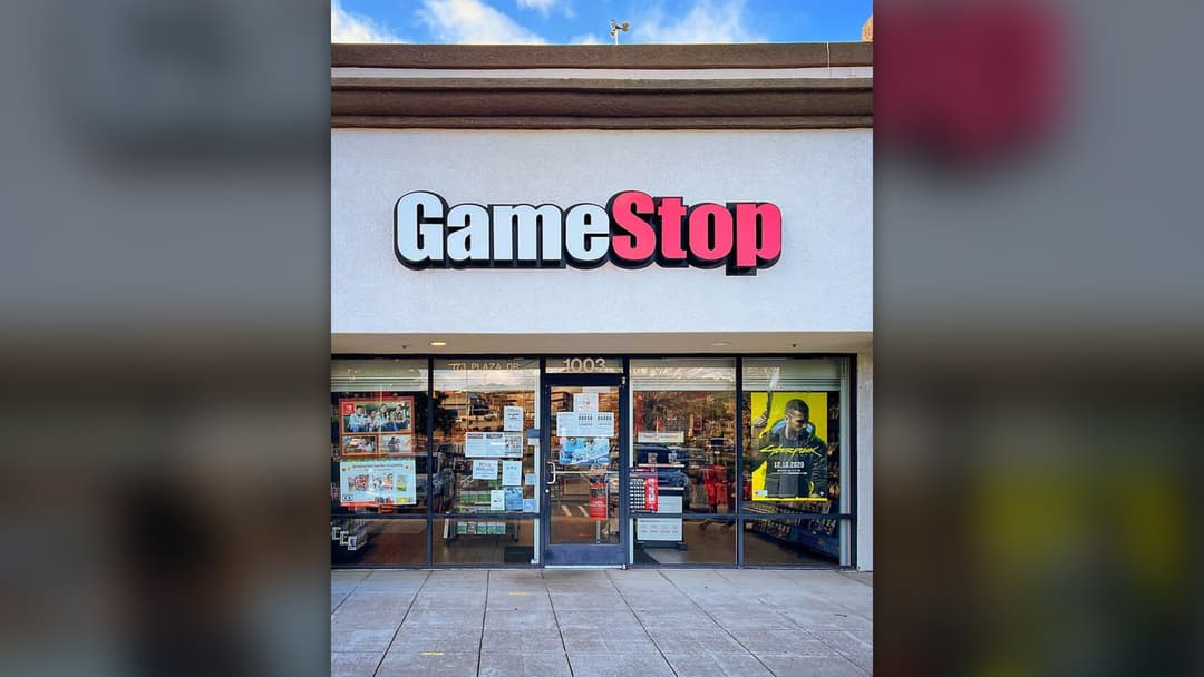 A retail video game storefront representing traditional physical media sales.
