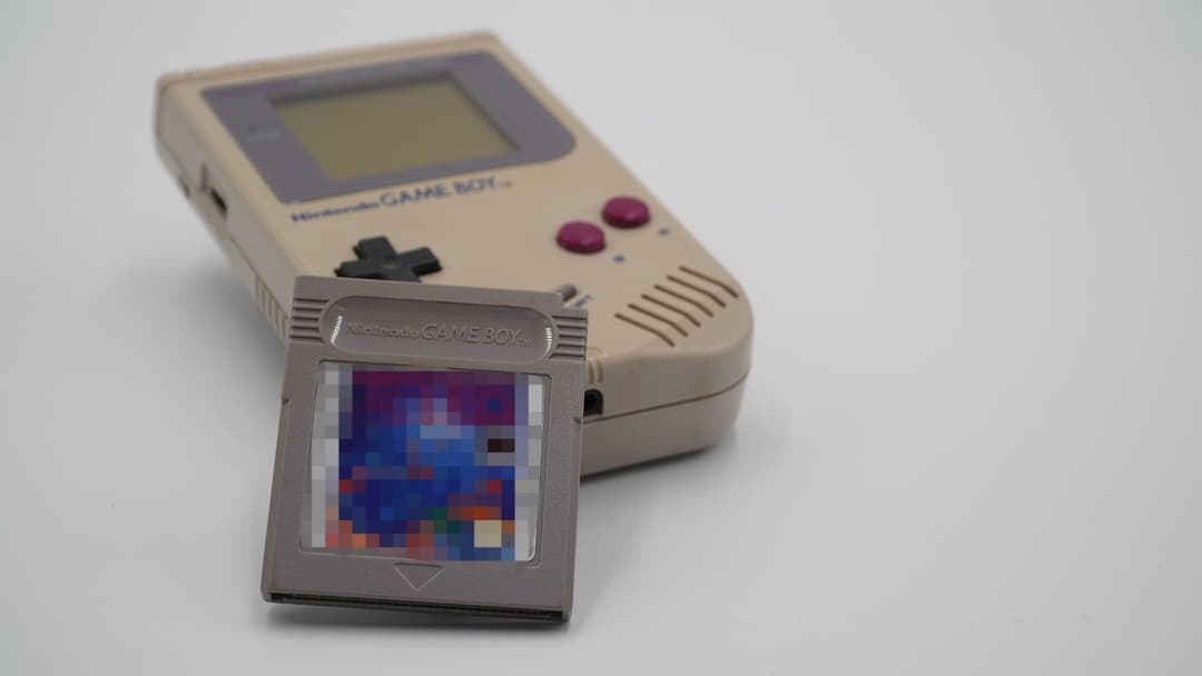 Original 1989 Nintendo Game Boy console in landscape view displaying Tetris on screen