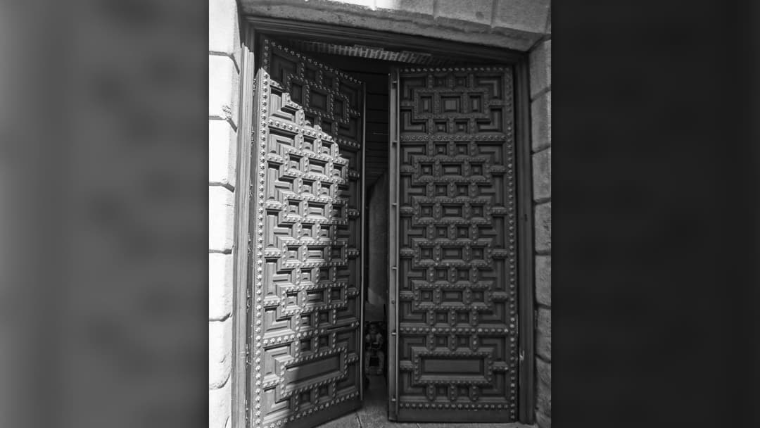 Heavy carved wooden doorway entrance and threshold