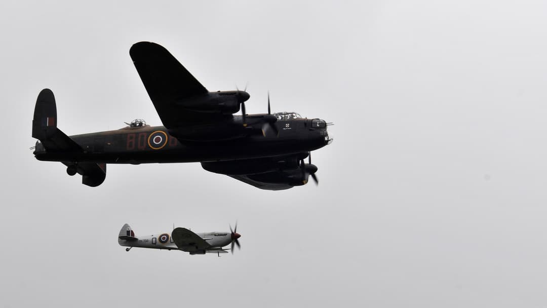 Supermarine Spitfire WWII British fighter interceptor banking in flight at Farnborough International Airshow