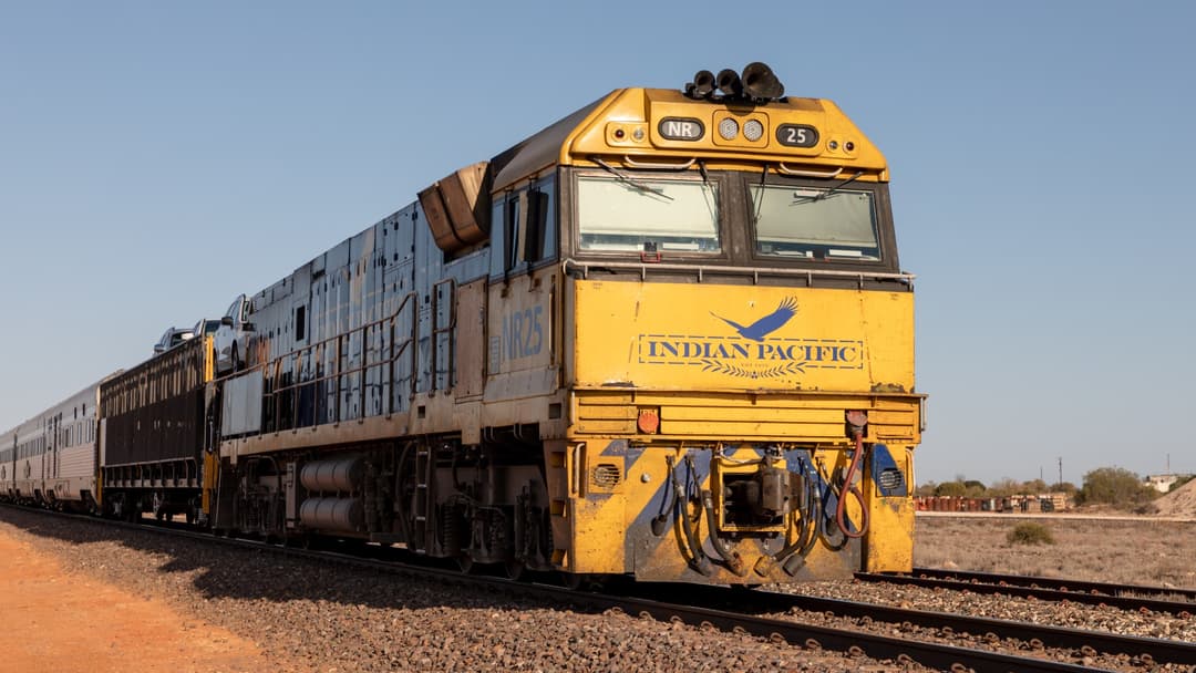 The Indian Pacific passenger train hauled by an NR class locomotive in Rawlinna, Western Australia.
