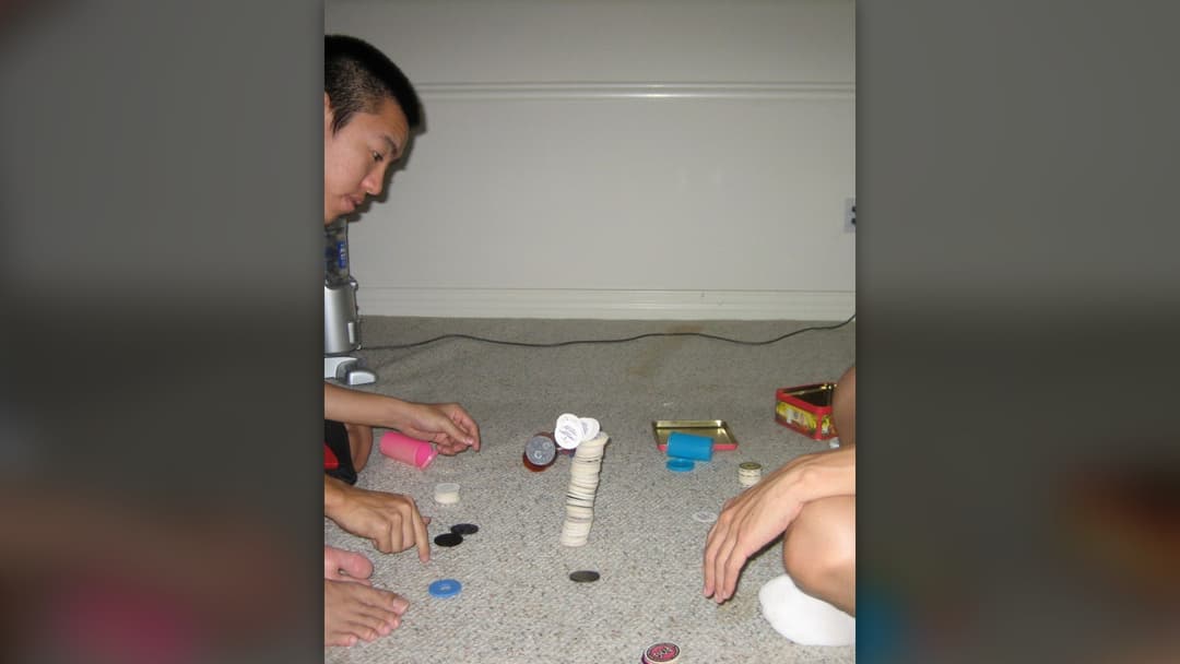 A game of Pogs with cardboard milk caps and slammers
