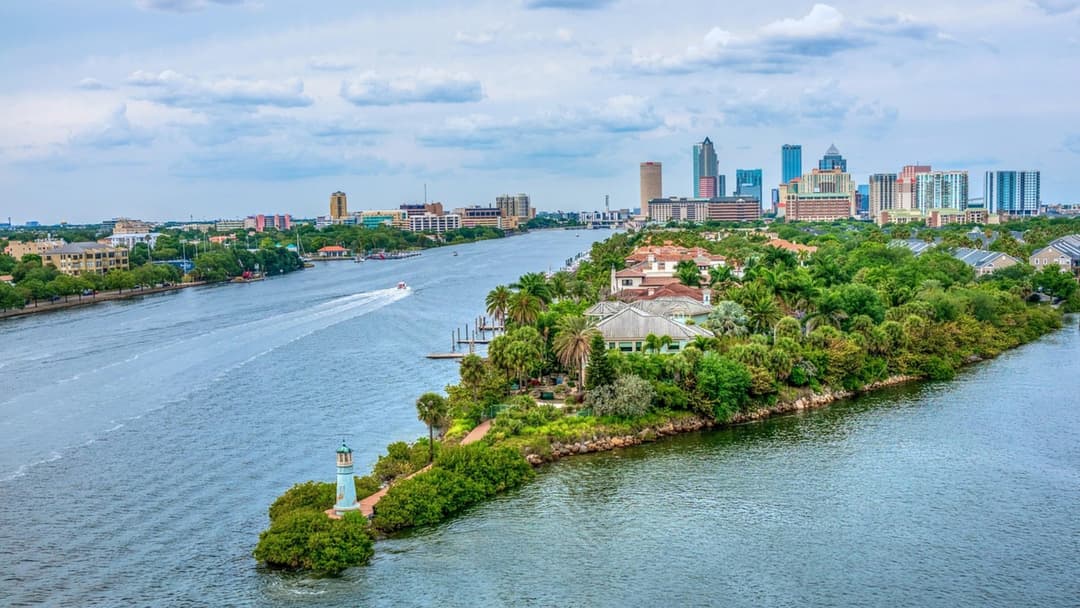 Waterfront skyline of Tampa Florida along the Gulf Coast under blue skies