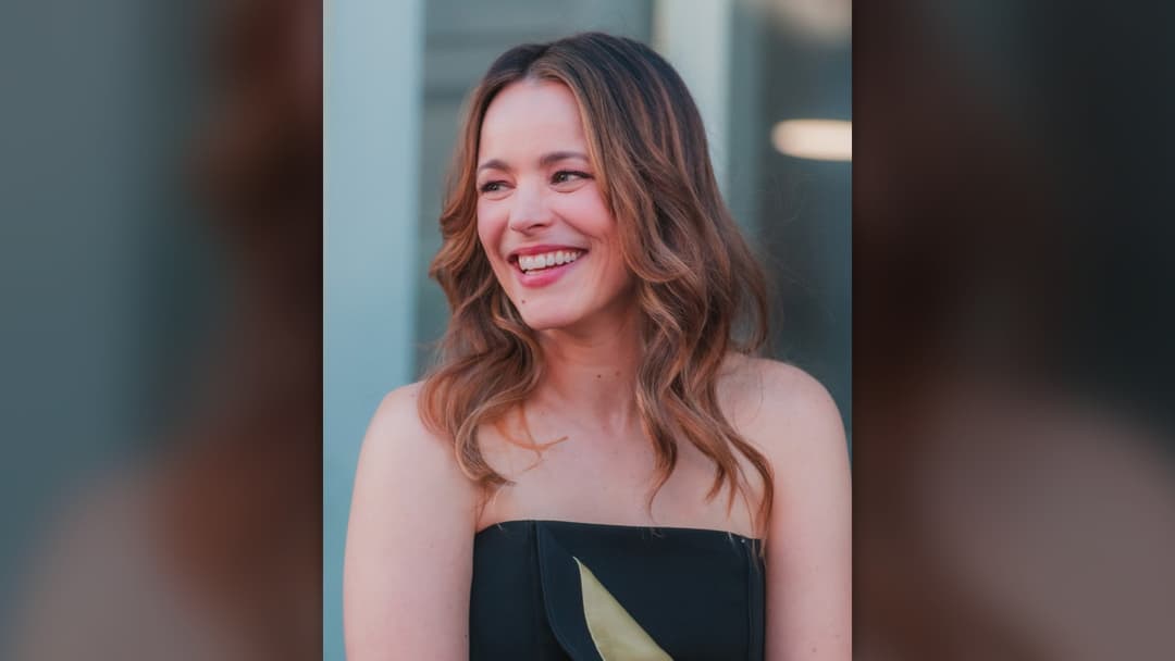 Actress Rachel McAdams smiling at a Hollywood Walk of Fame ceremony.