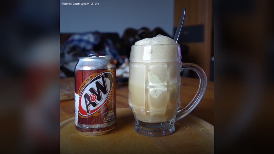 Classic frosted glass mug with root beer float and vanilla ice cream.