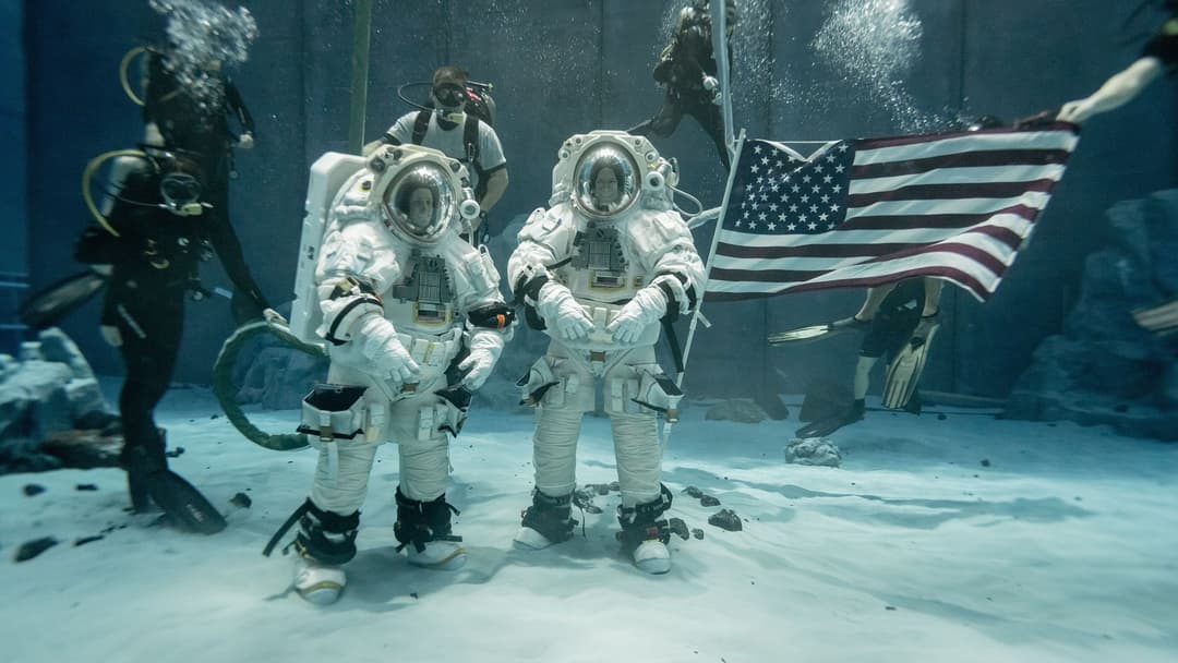 NASA astronauts training underwater in spacesuits inside the Neutral Buoyancy Laboratory pool in Houston