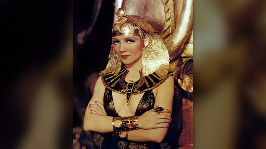 Claudette Colbert dressed in ornate Cleopatra costume in 1934