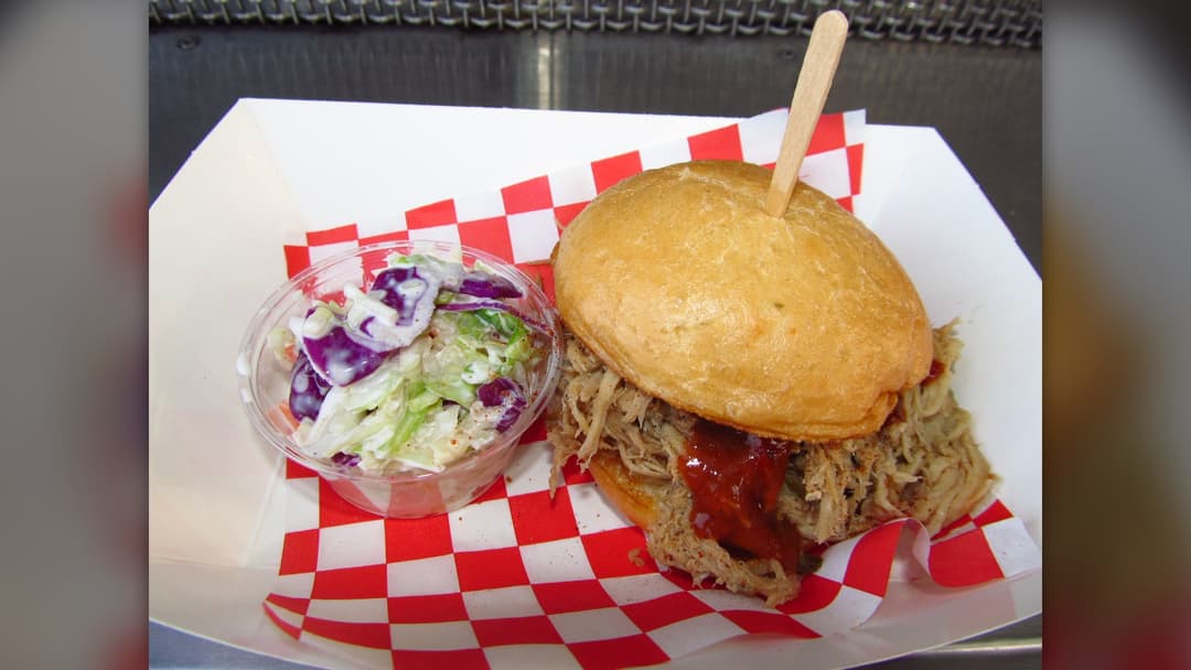 Barbecue pulled pork sliders on sweet buns with pickles