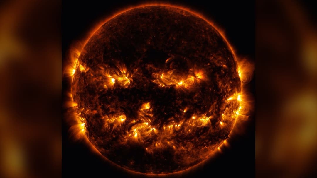 NASA Solar Dynamics Observatory ultraviolet image of the Sun resembling a glowing Halloween Jack-o'-Lantern
