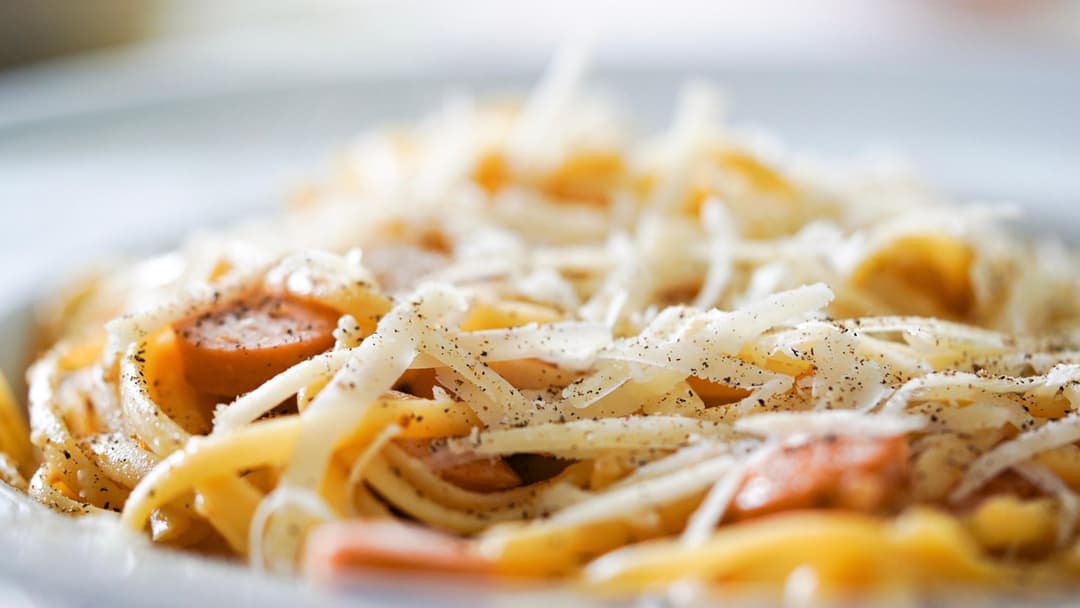 Pasta dish coated in heavy cream and cheese sauce