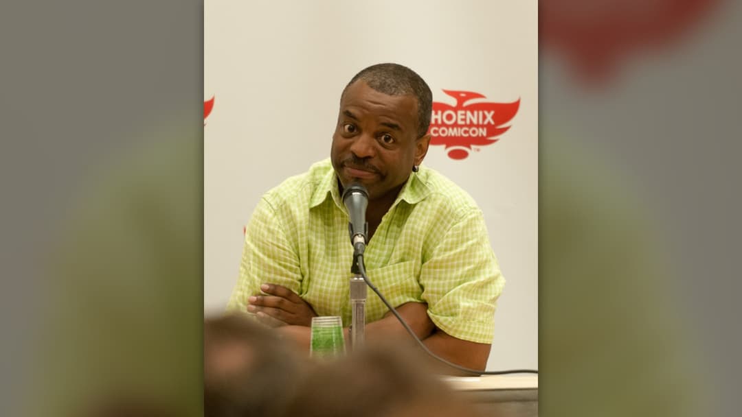 Actor LeVar Burton speaking at a microphone during the 2012 Phoenix Comicon